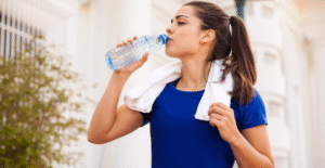 How does Alkaline water help balance pH levels in the body?